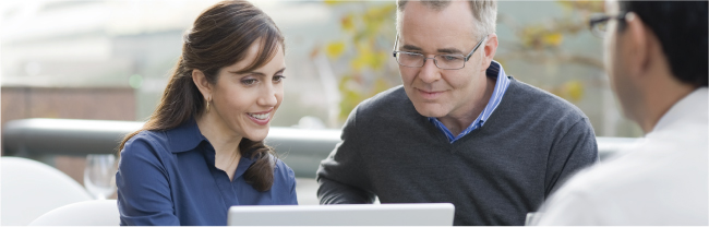 Three people discussing a financial plan